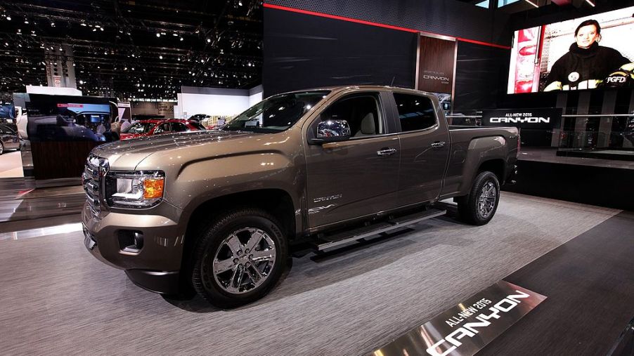 A 2015 GMC Canyon on display at an auto show