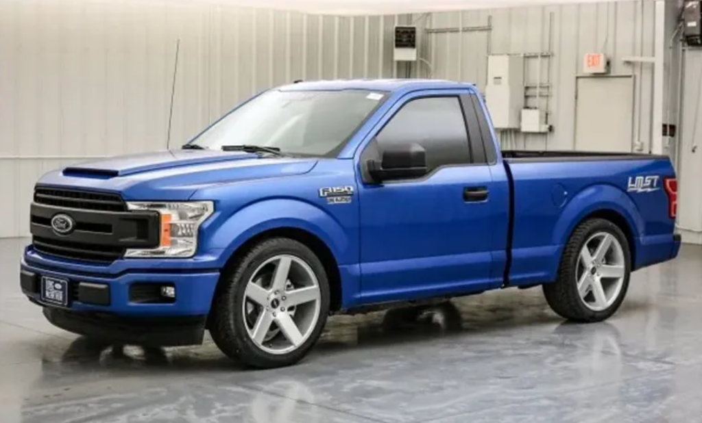 2019 Ford F-150 two door truck parked near warehouse 