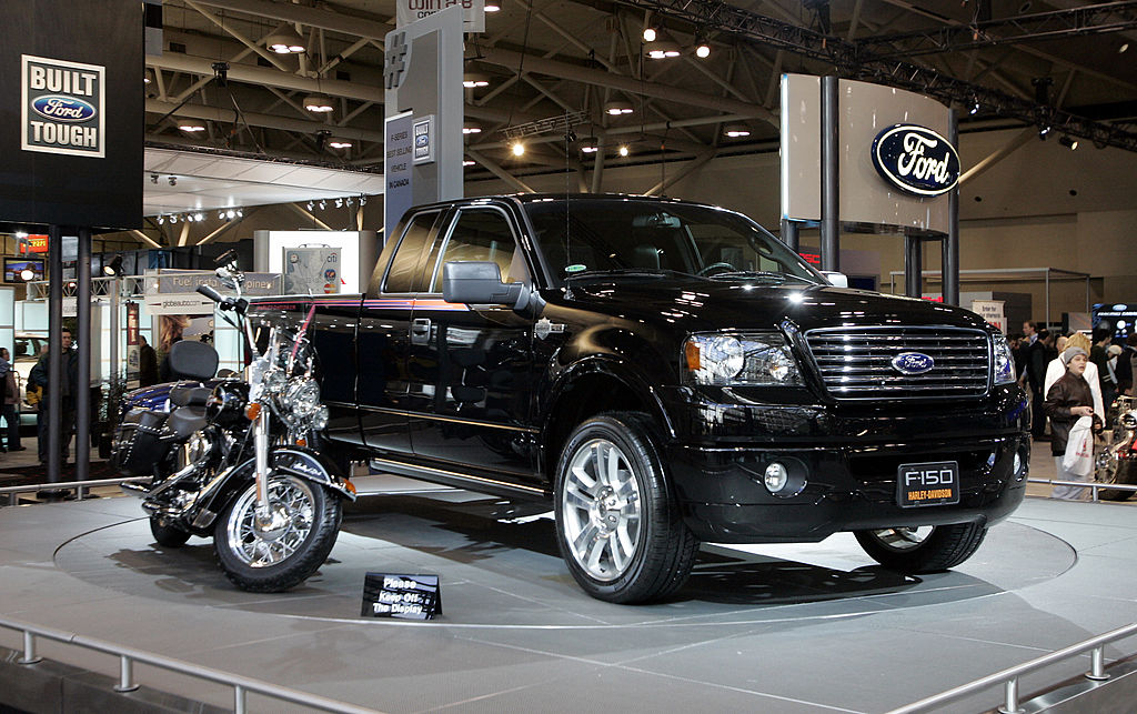 A Harley-Davidson inspired Ford truck next to a motorcycle