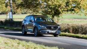 A Mazda CX-5 driving down the road