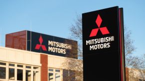 A Mitsubishi Motors sign outside of a building