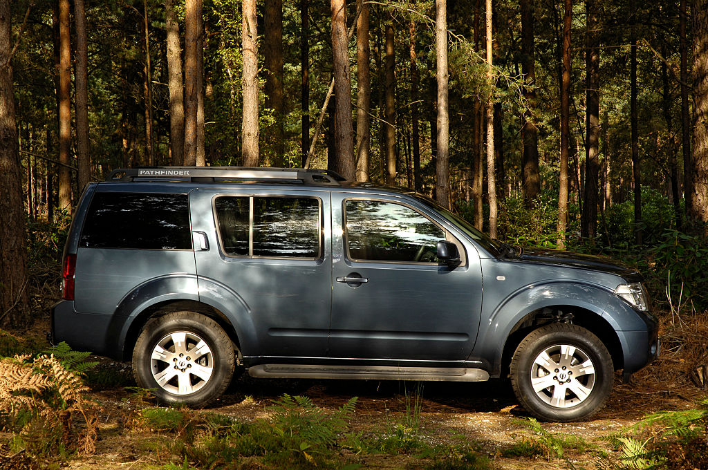 A 2005 Nissan Pathfinder parked in the woods