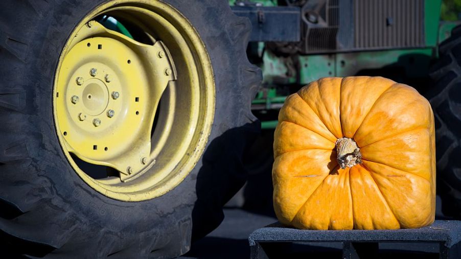 A square pumpkin next to a round wheel
