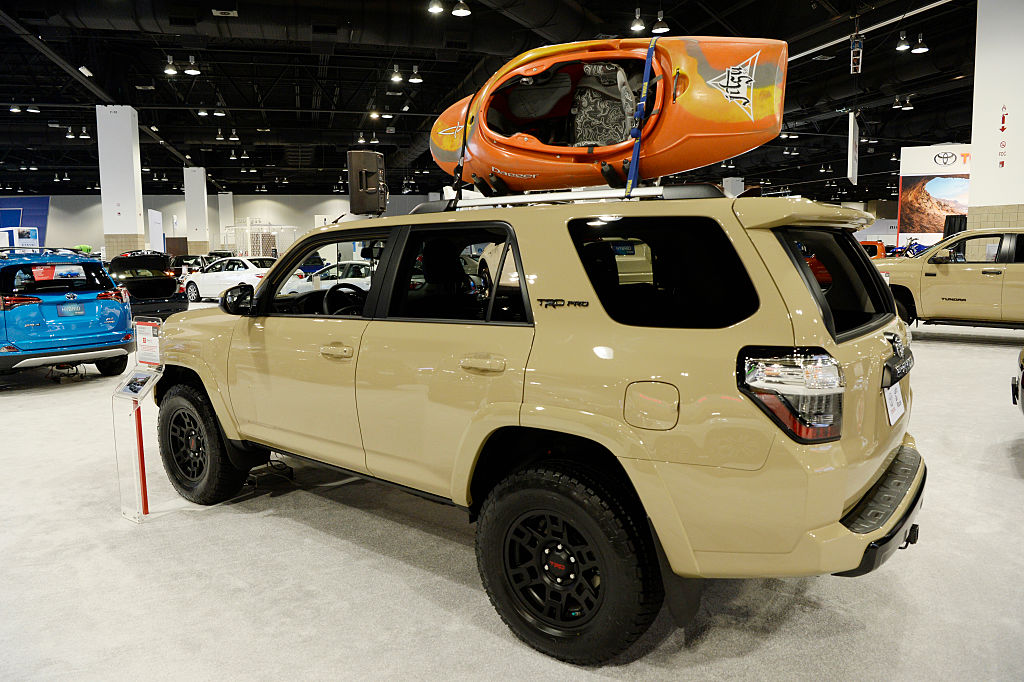 A tan Toyota 4Runner on display at an auto show