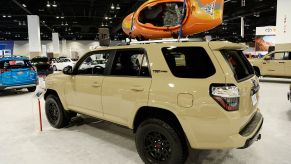 A tan Toyota 4Runner on display at an auto show