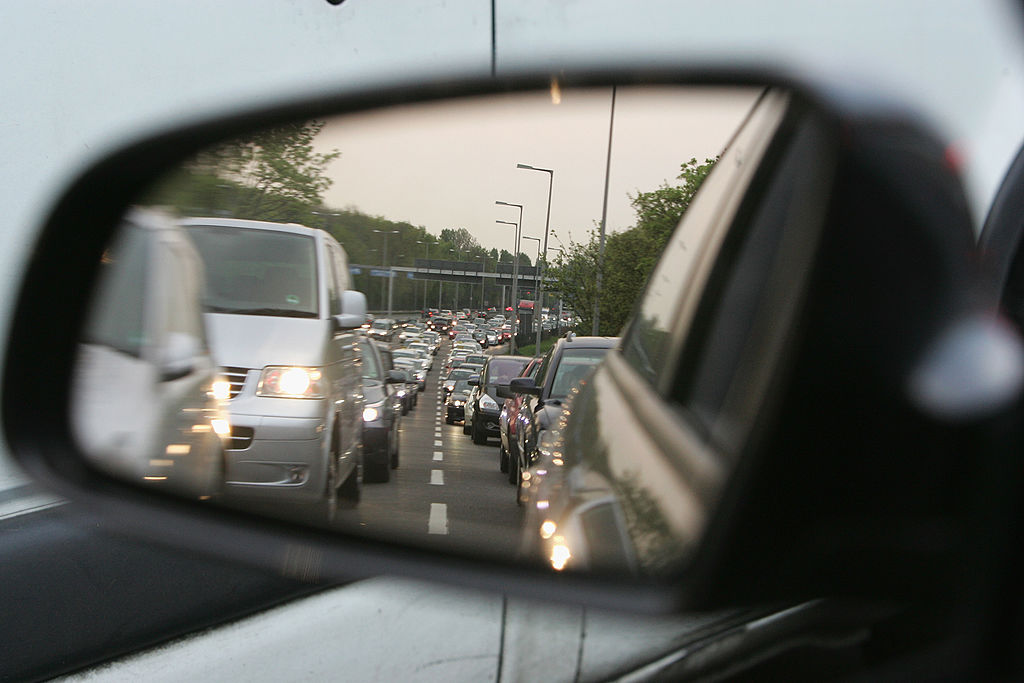 A traffic jam seen from a rear-view mirror