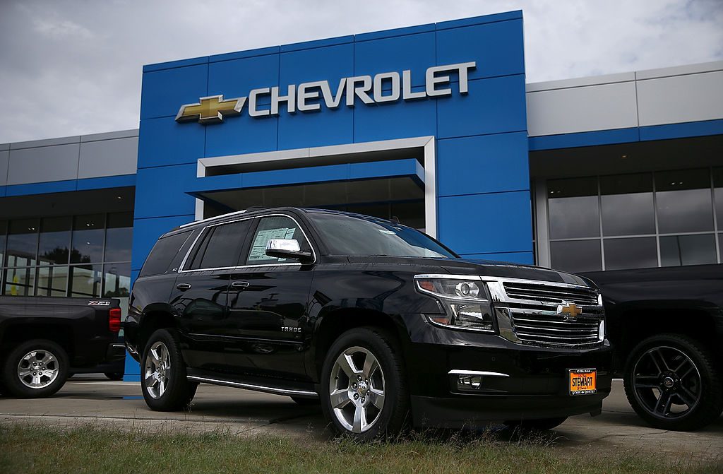 A Chevy Tahoe for sale outside of a car dealership