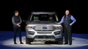 Jim Hackett (R), president and CEO of Ford Motor Company, and President of Global Operations Jim Farley speak at the reveal of the new 2020 Ford Explorer SUV at Ford Field