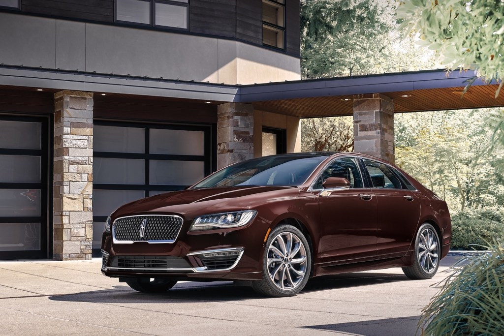 A handsome, burgundy 2020 Lincoln MKZ parked in a driveway.
