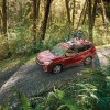 2020 Subaru Forester Limited driving down a gravel road in the woods