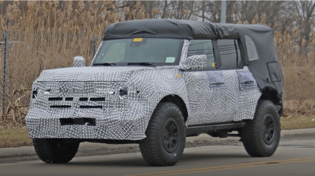 A testing mule for the 2021 Ford Bronco wrapped in camouflage