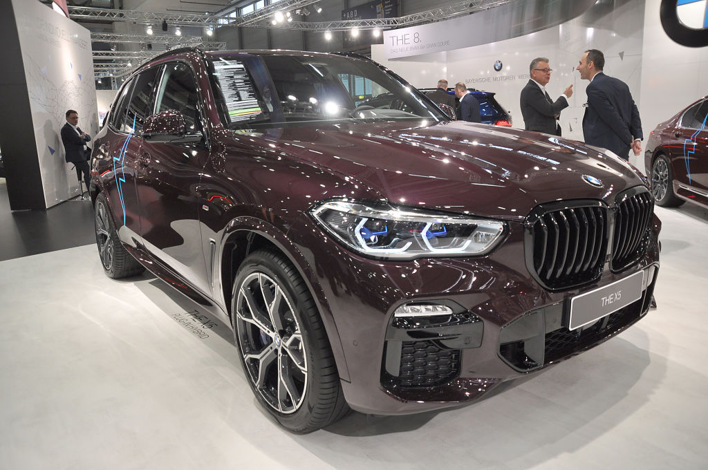 A BMW X5 on display at an auto show