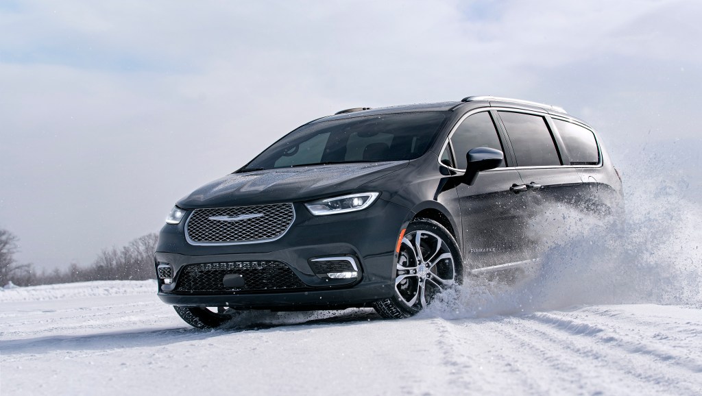 Dark gray 2021 Chrysler Pacifica with AWD drifting through the snow
