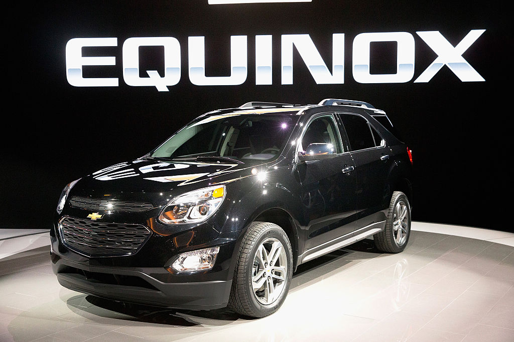 A black Chevy Equinox on display at an auto show
