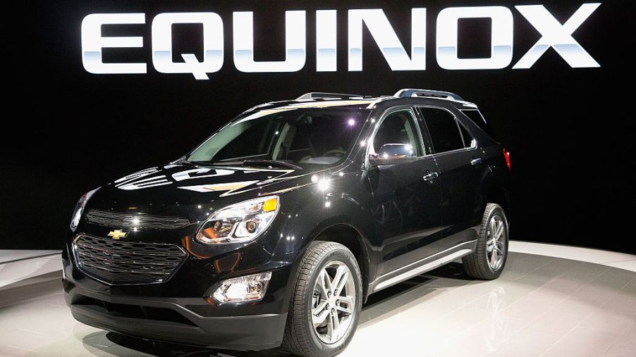 A black Chevy Equinox on display at an auto show