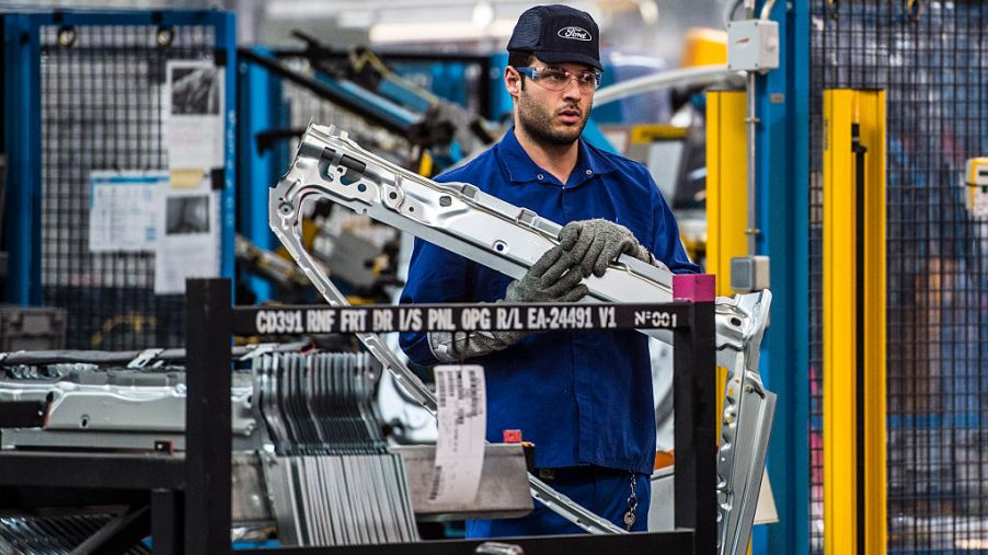 An employee works on Ford Mondeo vehicles on the production line during assembly at Ford plant in Almussafes