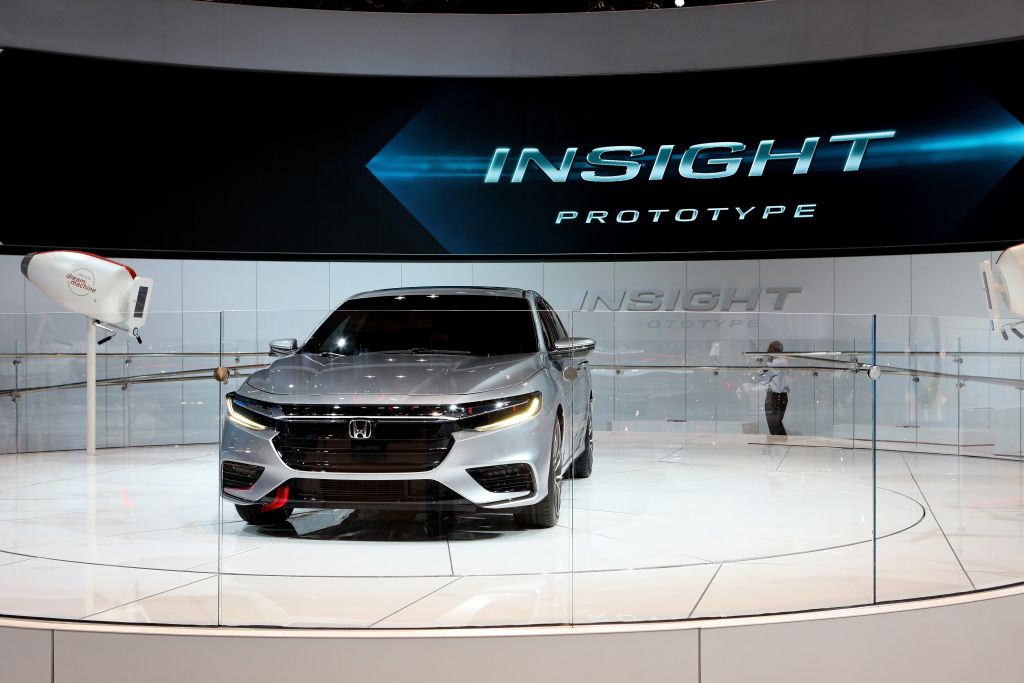 A Honda Insight on display at an auto show demonstrates great hybrid sedan that is also one of the best 2021 models under $30 grand