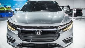 A Honda Insight on display at a car show