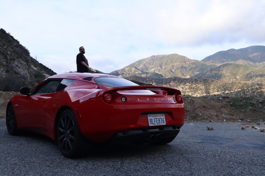 Ryan Horan stands admiring the scenery of the Angeles Crest Highway as we admire our new Lotus Evora | Gabrielle R DeSantis