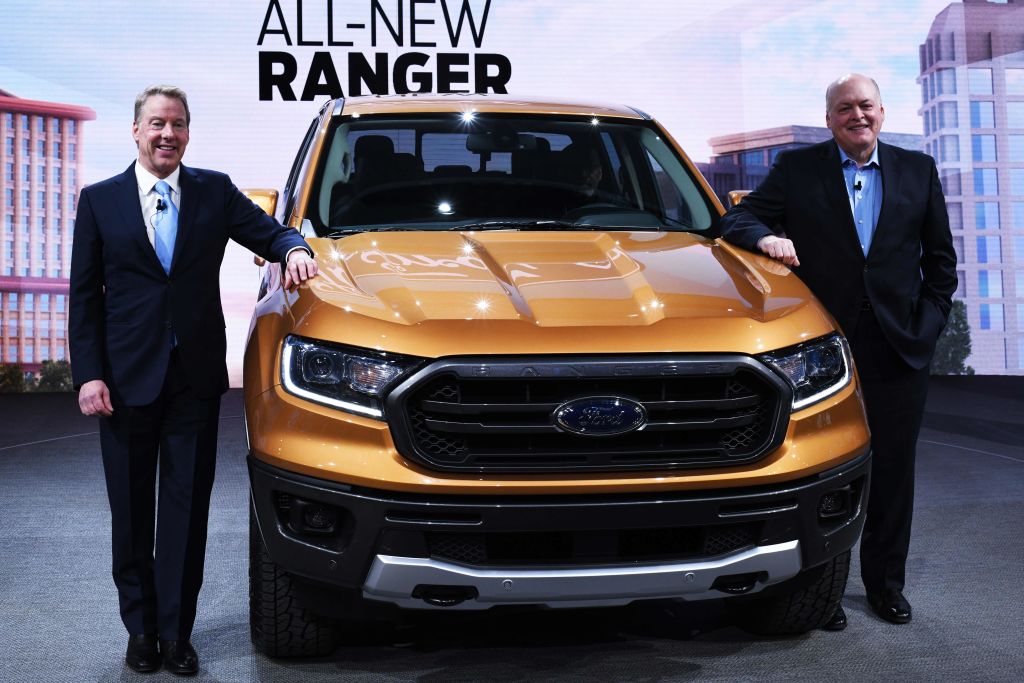 Bill Ford (L), executive chairman of the Ford Motor Company, and Jim Hackett (R), President and CEO, pose with the 2019 Ford Ranger