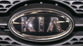 A Kia logo shown on the front of a car