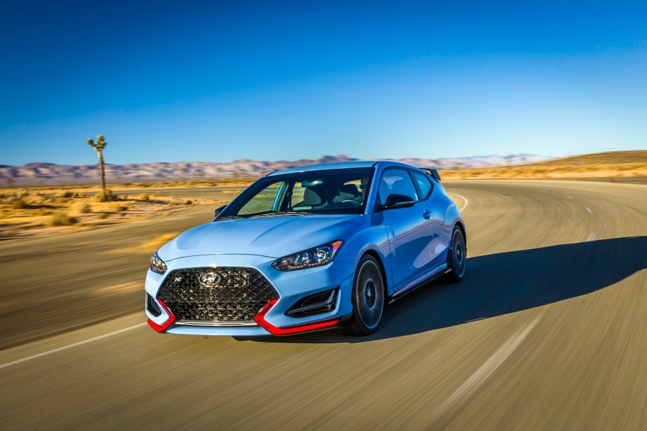 2020 Hyundai Veloster driving down truck