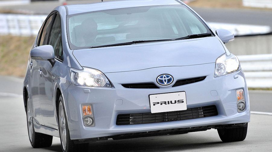 A person taking a Toyota Prius on a test drive