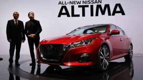 Denis Le Vot (left), the new chairman of Nissan North America and Alfonso Albaisa, senior vice president, Global Design, stand beside the 2019 Nissan Altima sedan at the New York International Auto Show