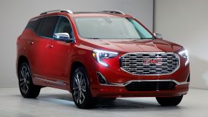 A red GMC Terrain on display at a car show
