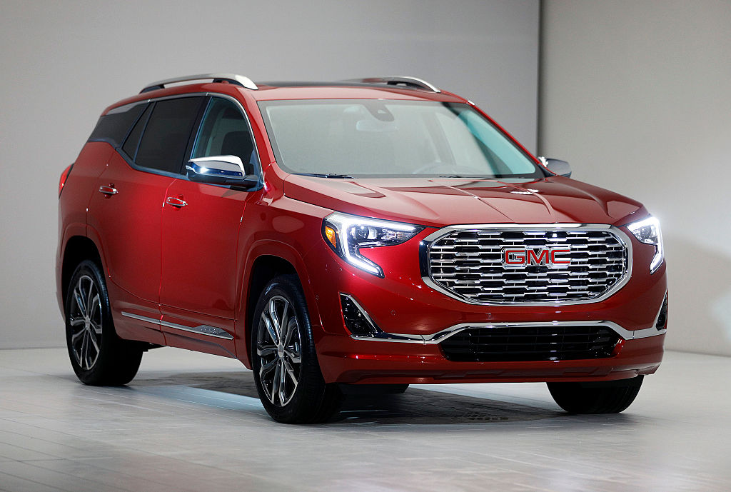 A red GMC Terrain on display at a car show