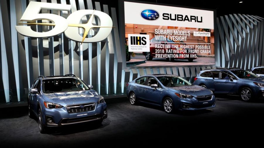 Subaru displaying a row of cars during an anniversary event.