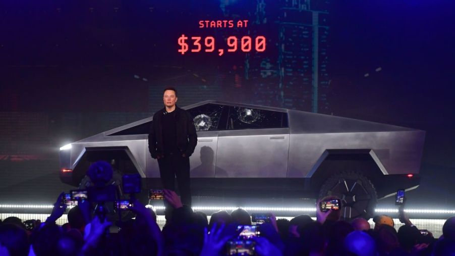 Elon Musk standing in front of the Tesla Cybertruck during its debut
