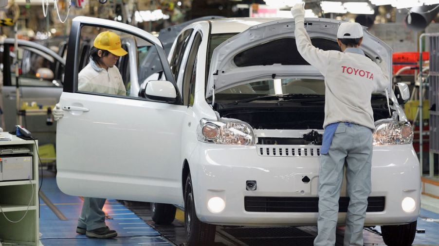 Toyota employees working on an assembly line