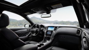 The front seats of a Infiniti Q50 sedan.