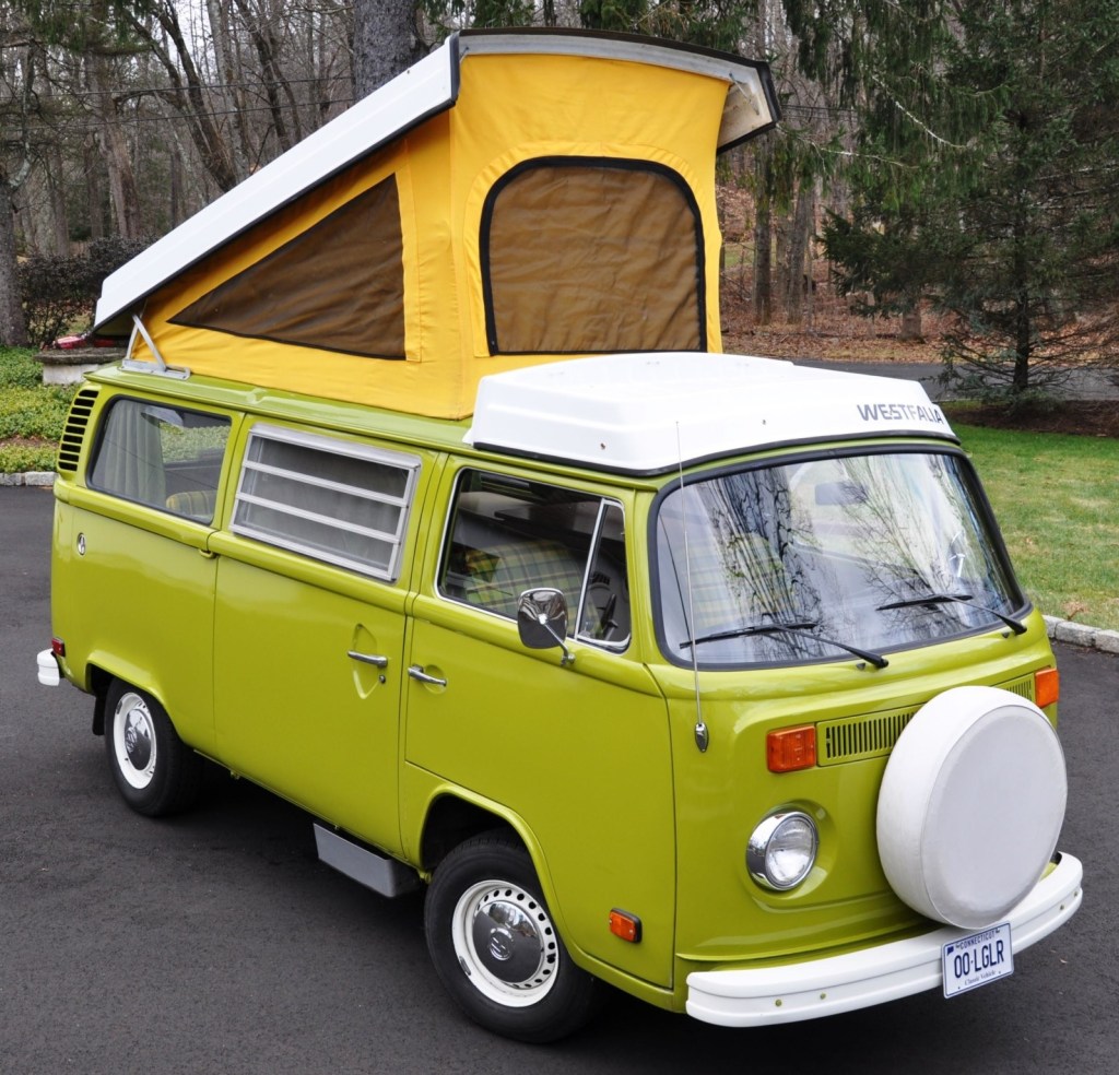Green 1976 Volkswagen Westfalia Bus camper van with yellow pop-up roof
