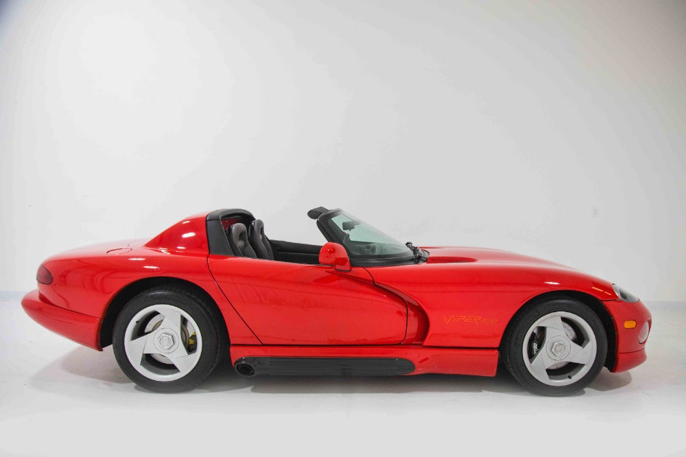 The profile of a red 1993 Dodge Viper RT/10.