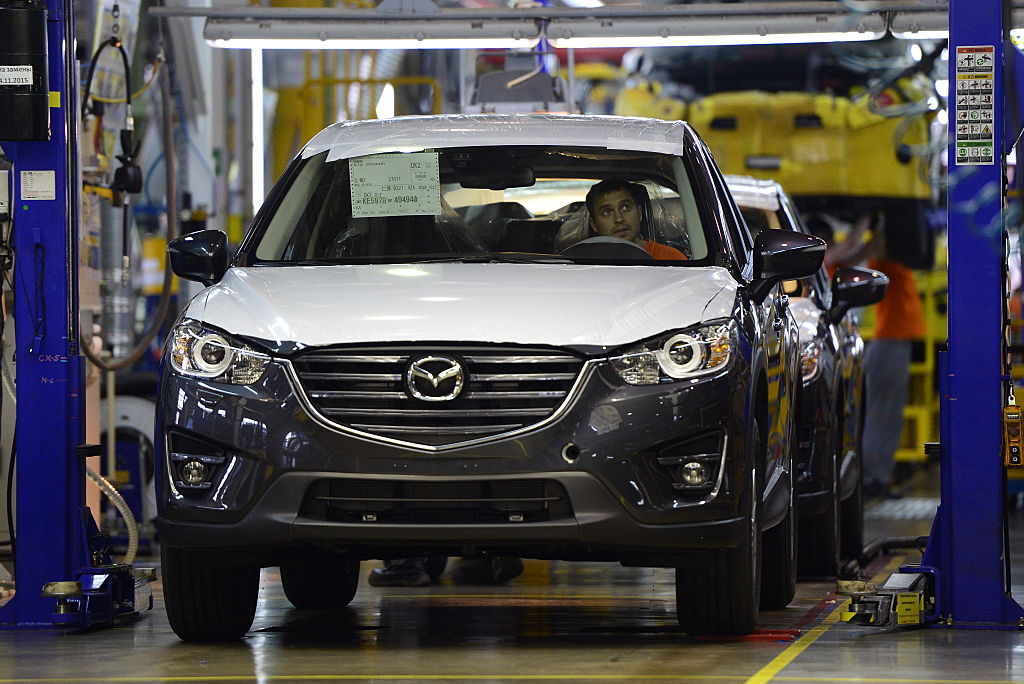 Mazda cars being produced at a factory