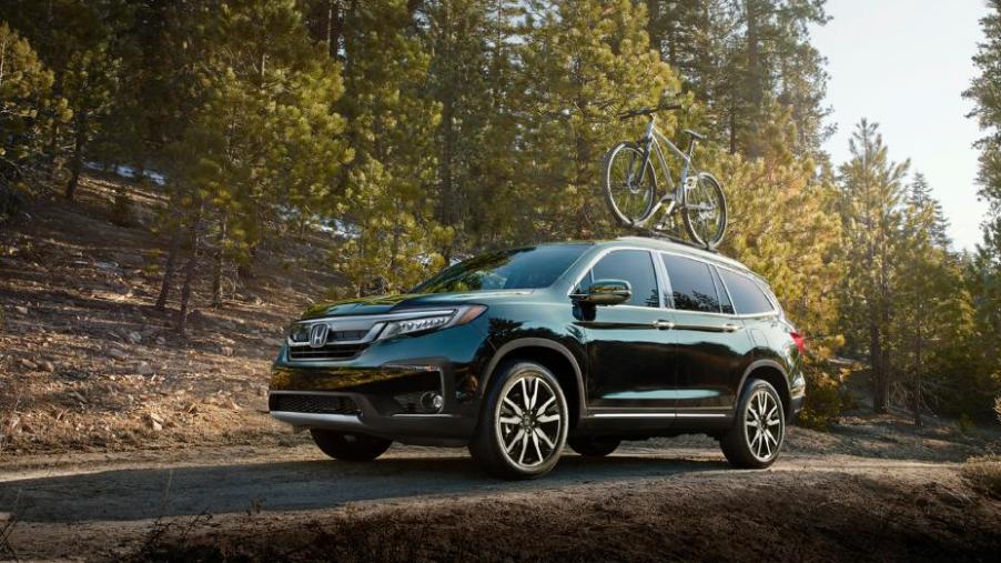 The 2020 Honda Pilot driving down the countryside.