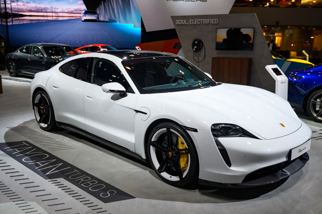 A 2020 Porsche Taycan on display at an auto show