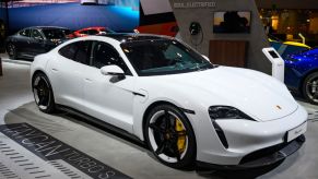 A 2020 Porsche Taycan on display at an auto show