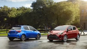 Two Yaris hatchbacks side by side.