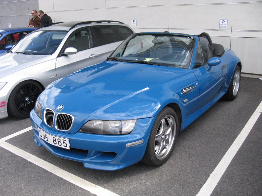 A blue 2001 BMW Z3 M Roadster parked in a parking lot.