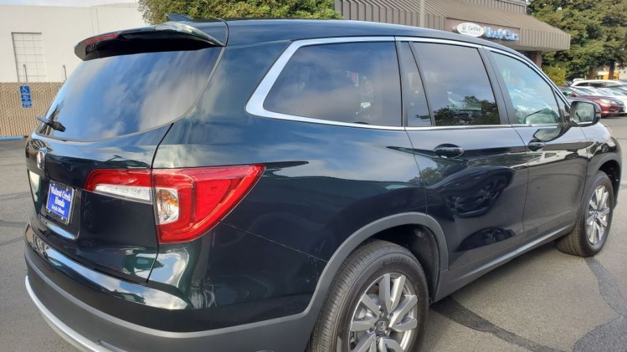A new Honda Pilot parked in a driveway