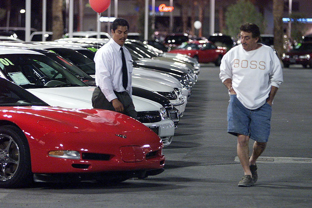 A man looking at buying a Corvette