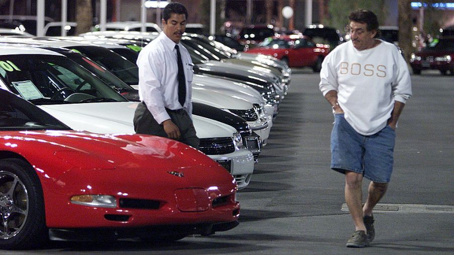 A man looking at buying a Corvette