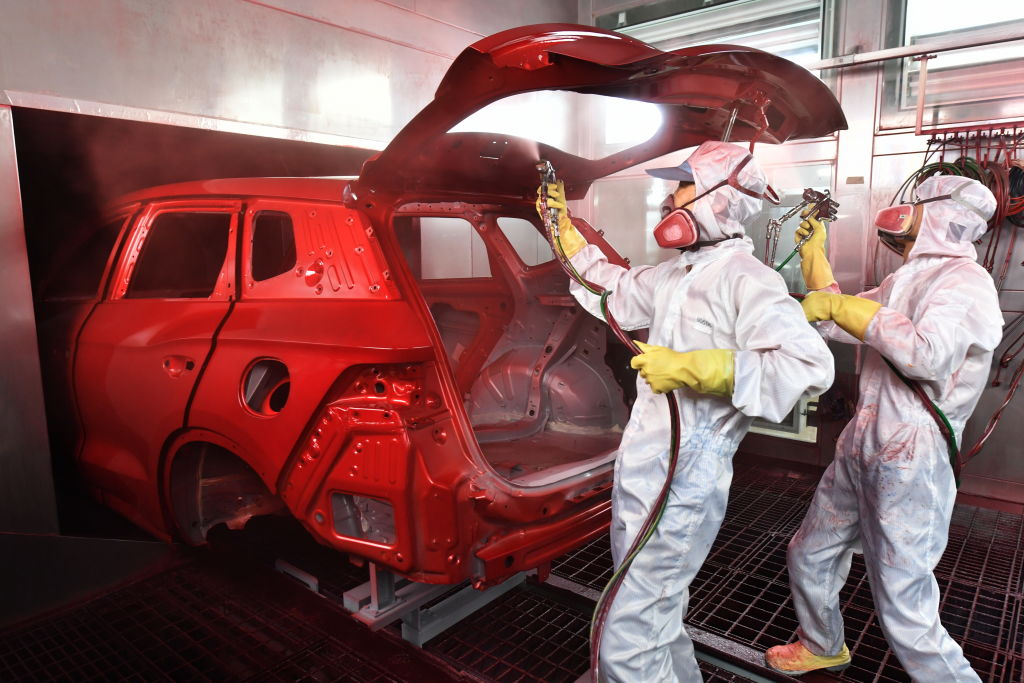 painters painting a car