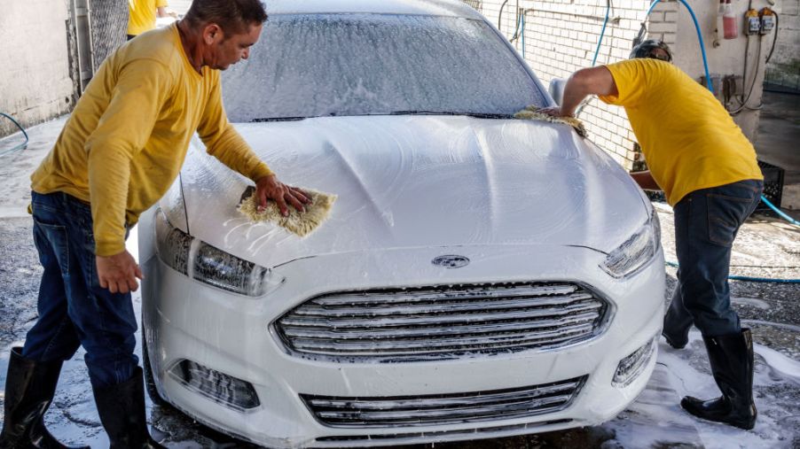 Miami, Little Havana, men working at car wash.