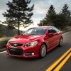 2014 Chevrolet SS in red driving down a road