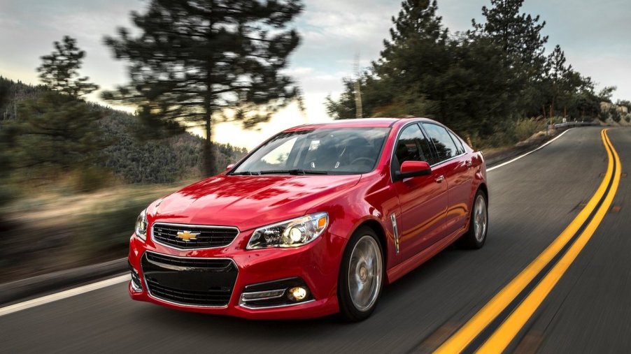 2014 Chevrolet SS in red driving down a road