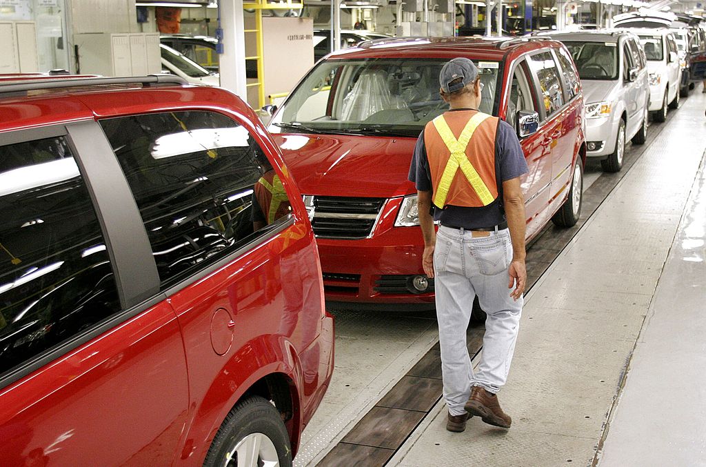 Dodge Grand Caravans being assembled in a factory
